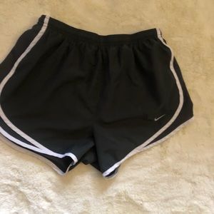 Dark grey woman’s Nike dri fit shorts